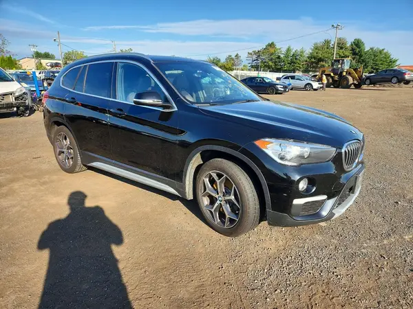 WBXHT3C38J3F03833 — 2018 BMW X1, photo 4 from Copart, Flood