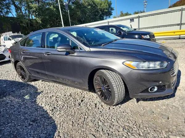 3FA6P0T94GR313679 — 2016 Ford Fusion, photo 4 from Copart 01.10.2026, Minor dents and scratches