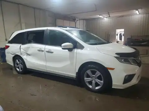 5FNRL6H73JB081145 — 2018 Honda Odyssey, photo 4 from Copart 24.09.2026, Side