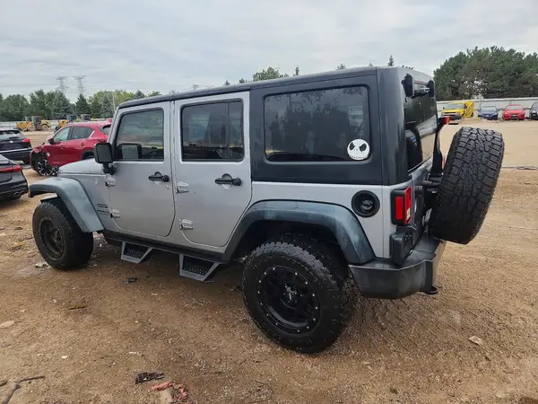 1C4HJWDG6GL200416 — 2016 Jeep Wrangler, photo 2 from Copart, Side
