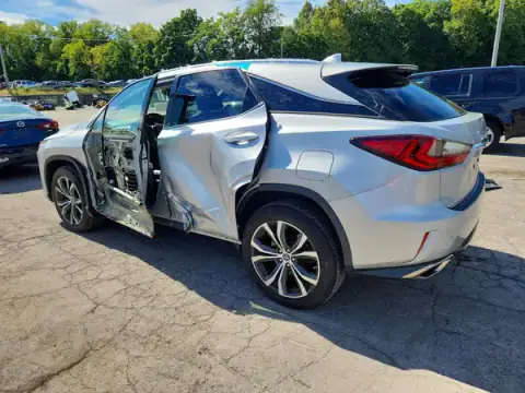 2T2BZMCA3KC207478 — 2019 Lexus RX, photo 2 from Copart, Side