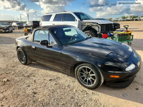 JM1NA3532V0736694 — 1997 Mazda MX-5, фото 4 с аукциона Copart, Боковая часть