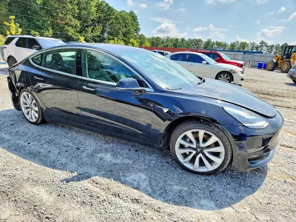 5YJ3E1EB3JF090438 — 2018 Tesla Model 3, photo 4 from Copart, Side