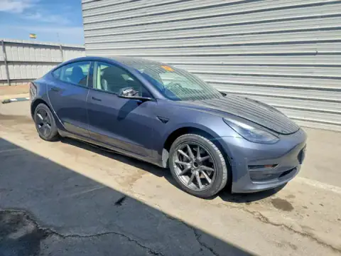 5YJ3E1EB8NF299034 — 2022 Tesla Model 3, foto 4 de Copart 05.10.2026, Lateral
