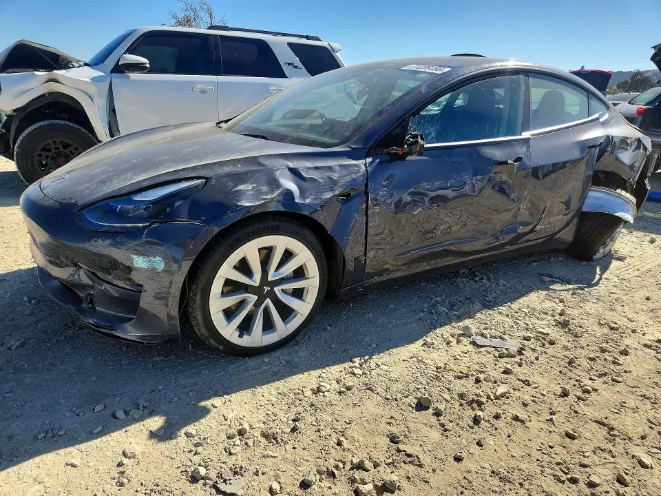 5YJ3E1EB5NF297953 Tesla Model 3 2022 — Rear end damage, before-repair photo
