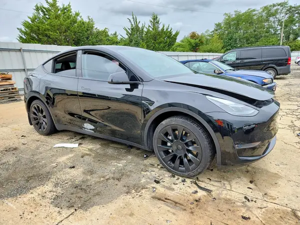 7SAYGAEEXPF605151 — 2023 Tesla Model Y, photo 4 from Copart, Side