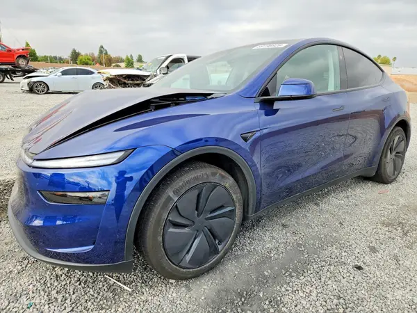 7SAYGDED0TF411540 Tesla Model Y 2026 — uszkodzenie Bok, zdjęcie przed naprawą