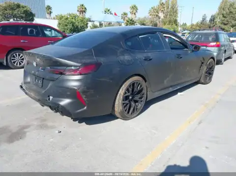 WBSGV0C02MCF96904 — 2021 BMW M8, photo 4 from IAAI, Left side