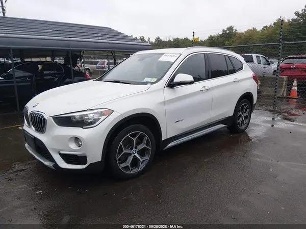 WBXHT3C39J5K27082 — 2018 BMW X1, photo 2 from IAAI, Flood