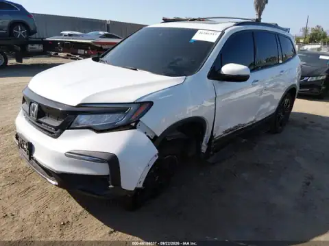 5FNYF6H78MB057821 — 2021 Honda Pilot, photo 2 from IAAI, Left side