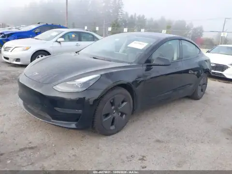 5YJ3E1EB0PF694599 — 2023 Tesla Model 3, photo 2 from IAAI 22.10.2026, Left rear
