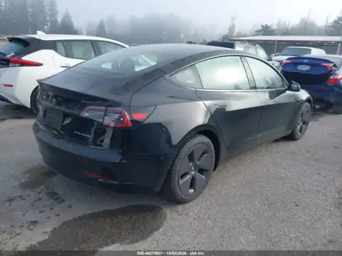 5YJ3E1EB0PF694599 — 2023 Tesla Model 3, photo 4 from IAAI 22.10.2026, Left rear
