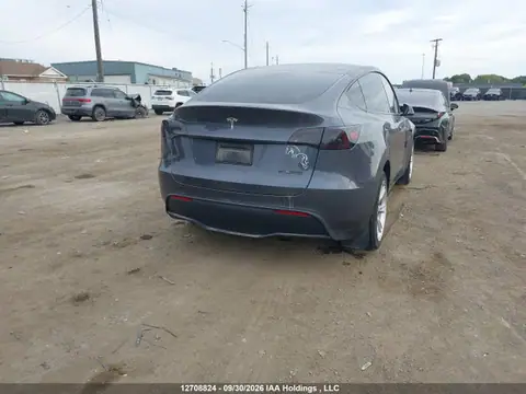 LRWYGDEE9PC163035 — 2023 Tesla Model Y Long Range, фото 4 с аукциона IAAI 23.10.2026, Подтопление