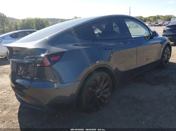 7SAYGDEF1PF863939 — 2023 Tesla Model Y, photo 4 from IAAI 09.10.2026, Flood