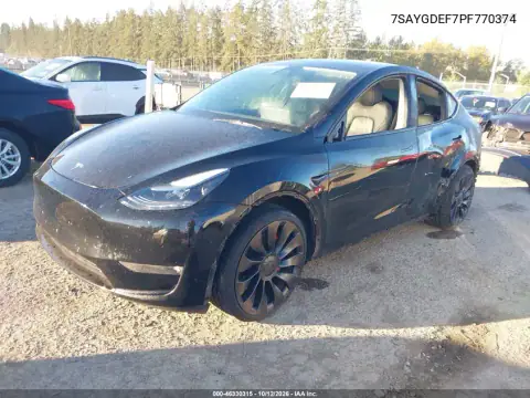 7SAYGDEF7PF770374 — 2023 Tesla Model Y, photo 2 from IAAI 21.10.2026, Left side